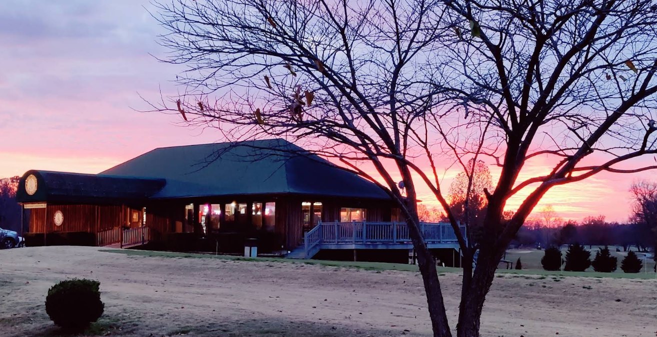 The clubhouse and grounds at sunset