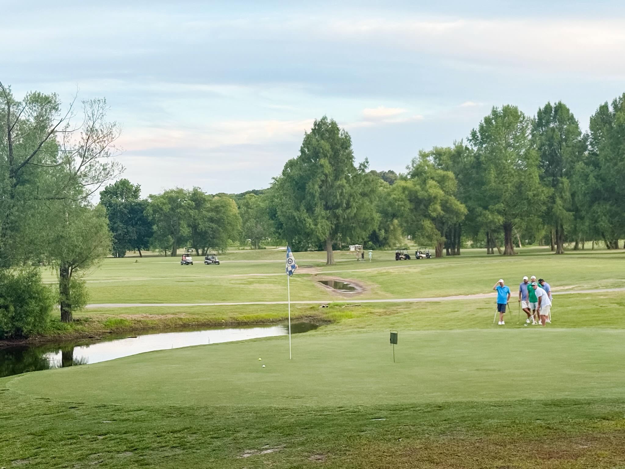 A green guarded by water on the championship course