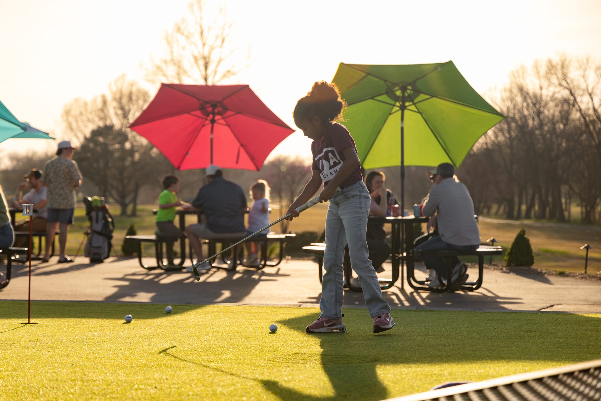 Golden-hour life at The Creeks: the patio, the music, and the course