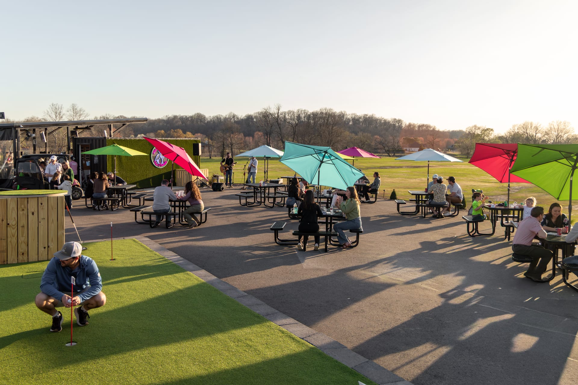 Golden-hour life at The Creeks: the patio, the music, and the course