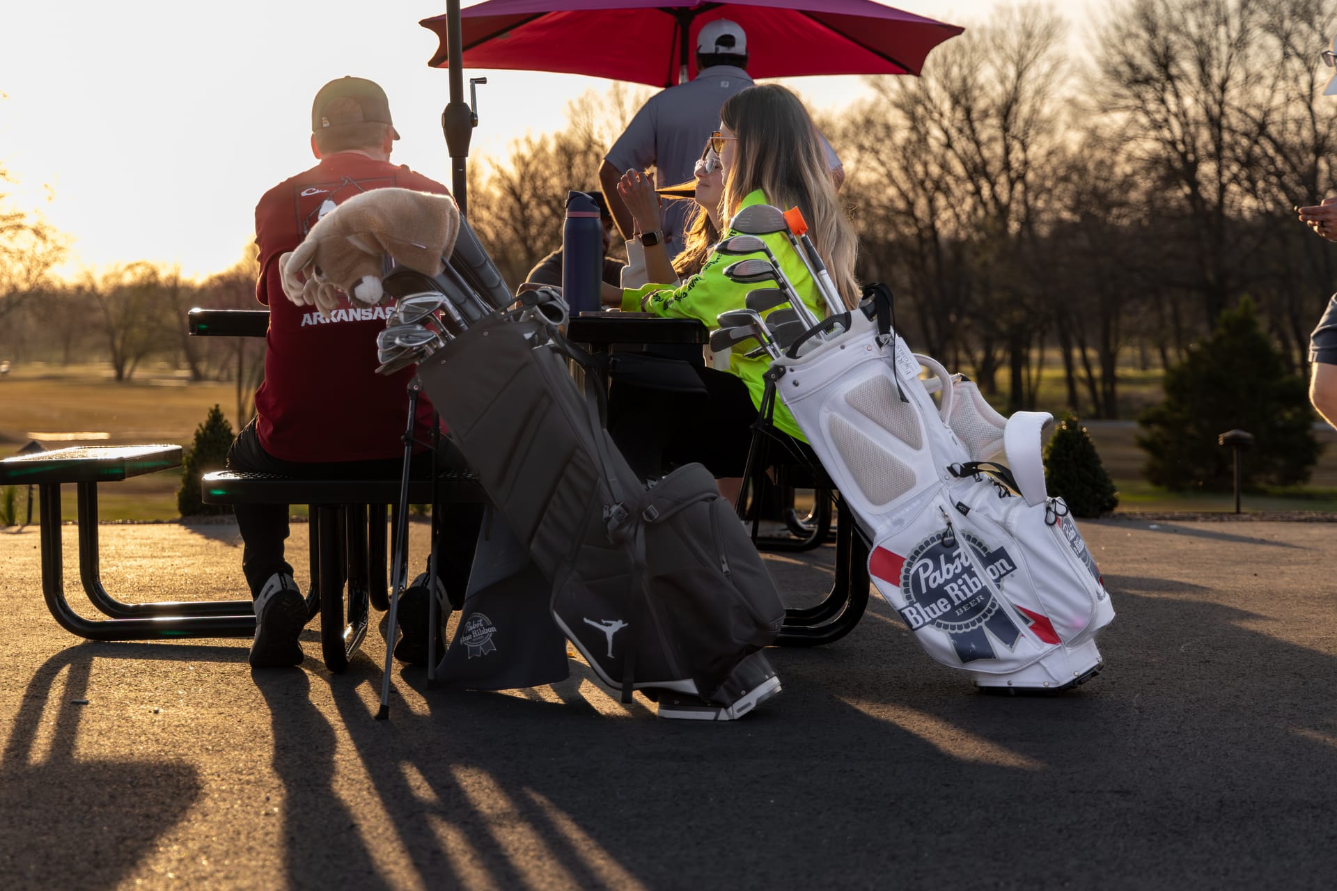 Golden-hour life at The Creeks: the patio, the music, and the course