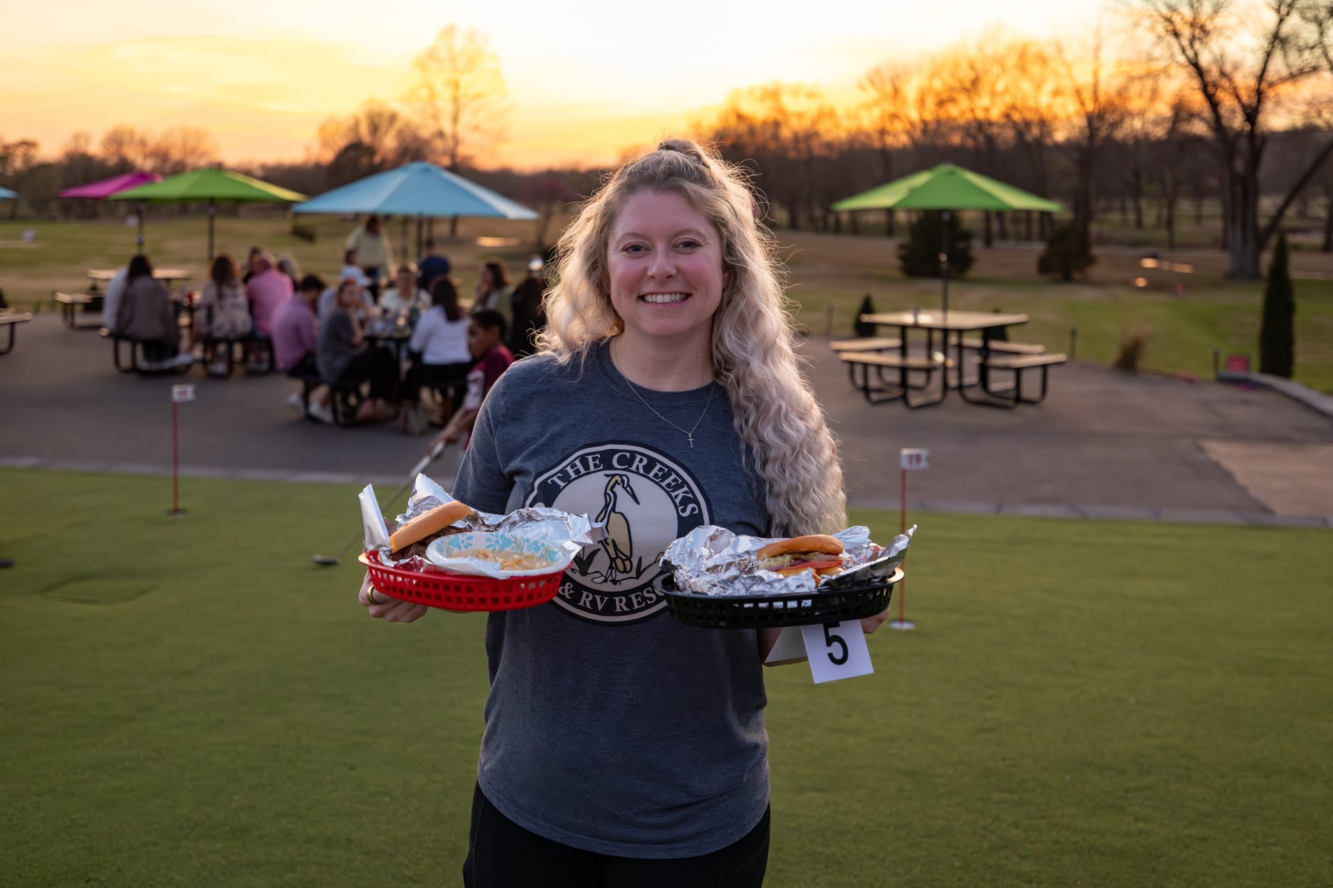 Golden-hour life at The Creeks: the patio, the music, and the course